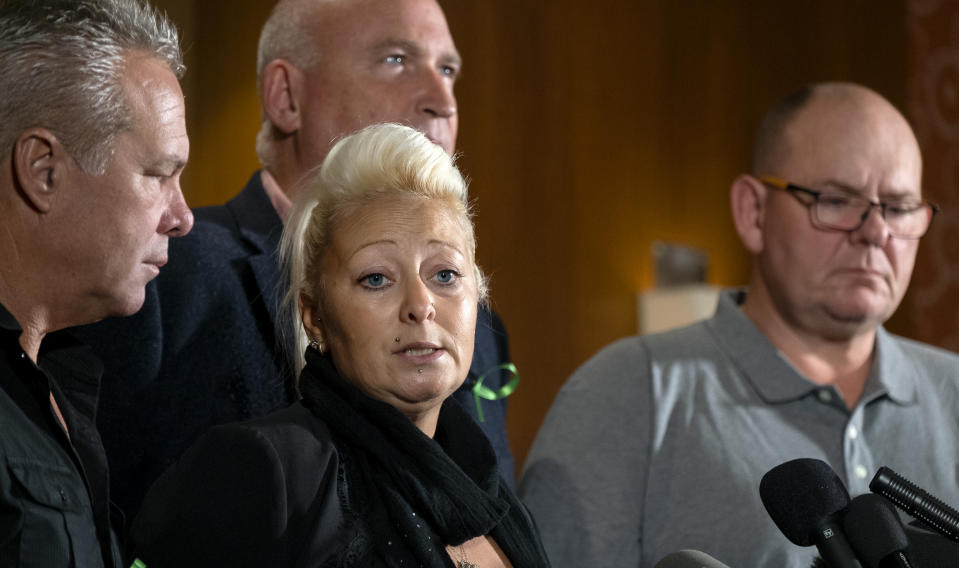 Charlotte Charles, mother of Harry Dunn, who died after his motorbike was involved in an August 2019 accident in Britain with Anne Sacoolas, wife of an American diplomat, speaks at news conference as she is joined by Dunn's father Tim Dunn, far right, and other family members and supporters Monday, Oct. 14, 2019, in New York. The family is seeking answers after Sacoolas returned to the United States after being granted diplomatic immunity following the crash. (AP Photo/Craig Ruttle)