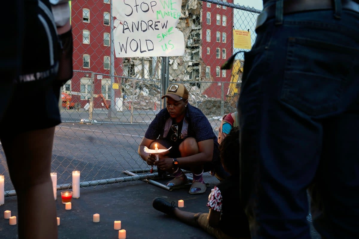 Davenport residents attend a small vigil for the victims feared trapped under the rubble (Copyright 2023 The Associated Press. All rights reserved.)