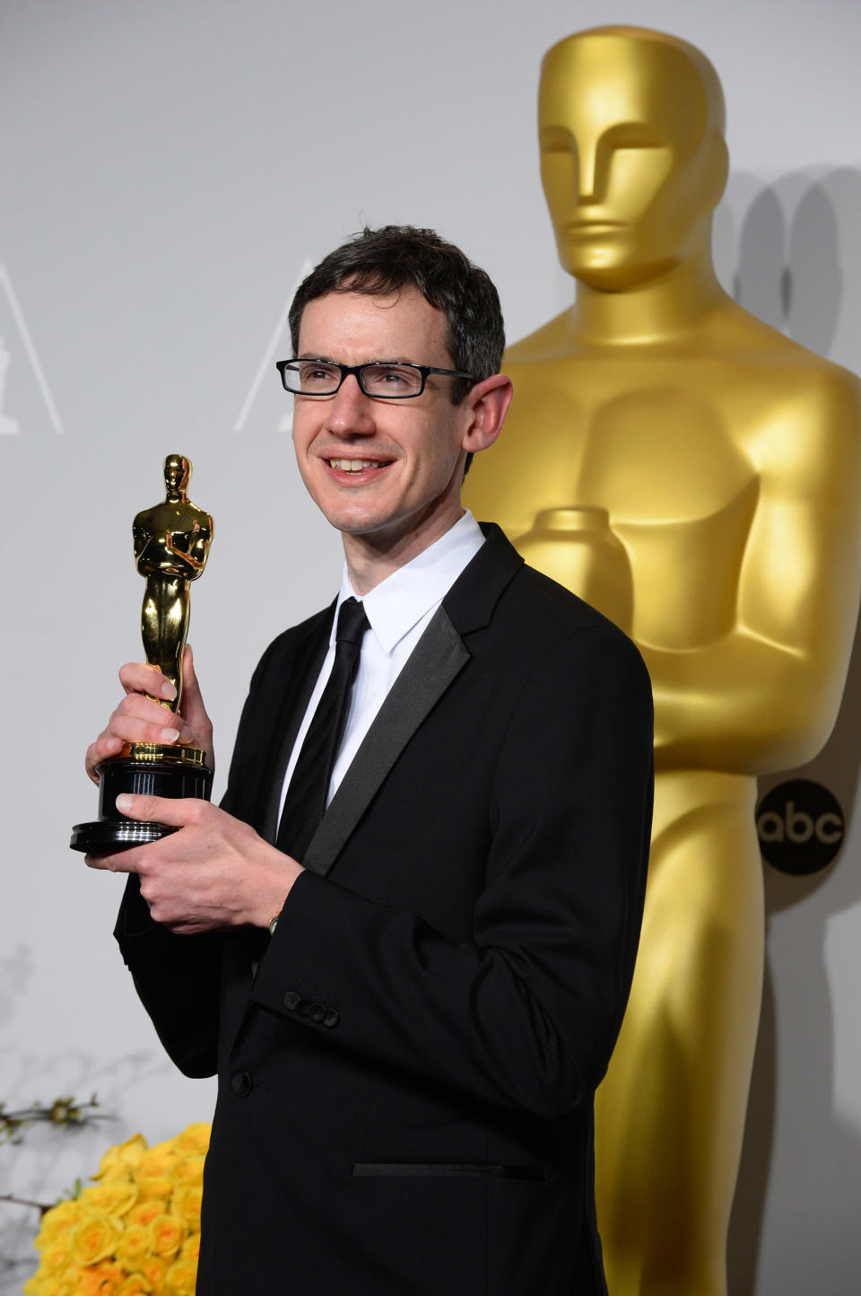 Steven Price poses in the press room with the award for original score in a feature film for "Gravity" during the Oscars at the Dolby Theatre on Sunday, March 2, 2014, in Los Angeles. (Photo by Jordan Strauss/Invision/AP)