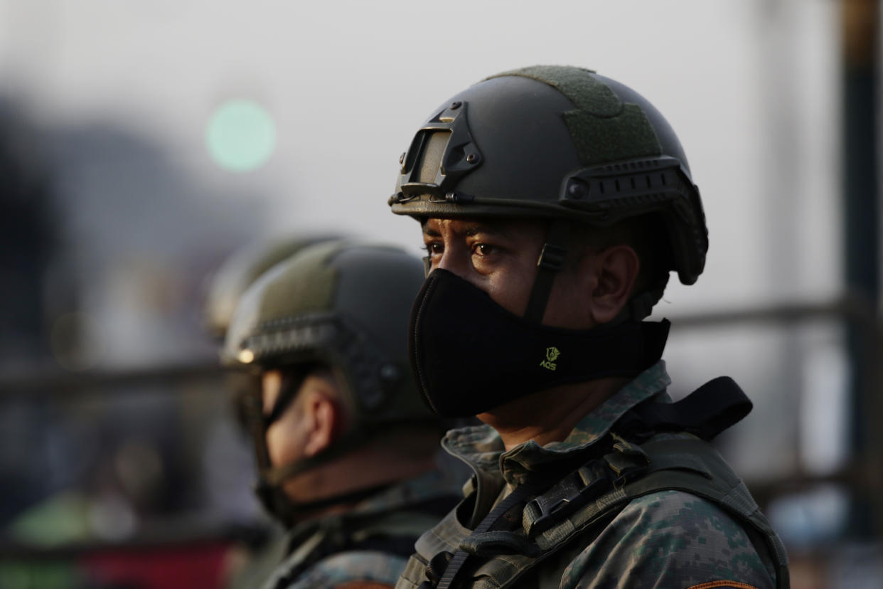 Soldiers guard the Litoral Penitentiary after a prison riot, in Guayaquil, Ecuador, Wednesday, September 29, 2021. Authorities report at least 100 dead and 52 injured during the riot on Tuesday at the prison. (AP Photo/Angel DeJesus)