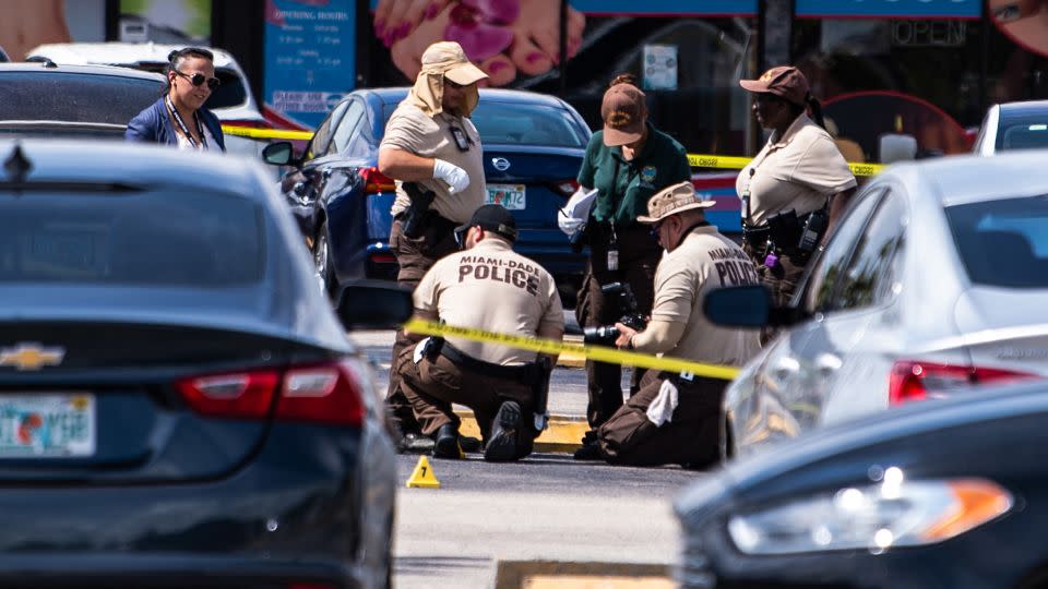 Miami Dade police officers collect evidence at the scene of the May 30, 2021, shooting near Hialeah. - Chandan Khanna/AFP/Getty Images/File