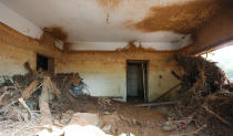 <p>Flood level marks are seen on the wall inside a room filled with muds and debris in a house after the flash flood at Pentagon, Regent town, Sierra Leone on Aug. 18, 2017. (Photo: Afolabi Sotunde/Reuters) </p>