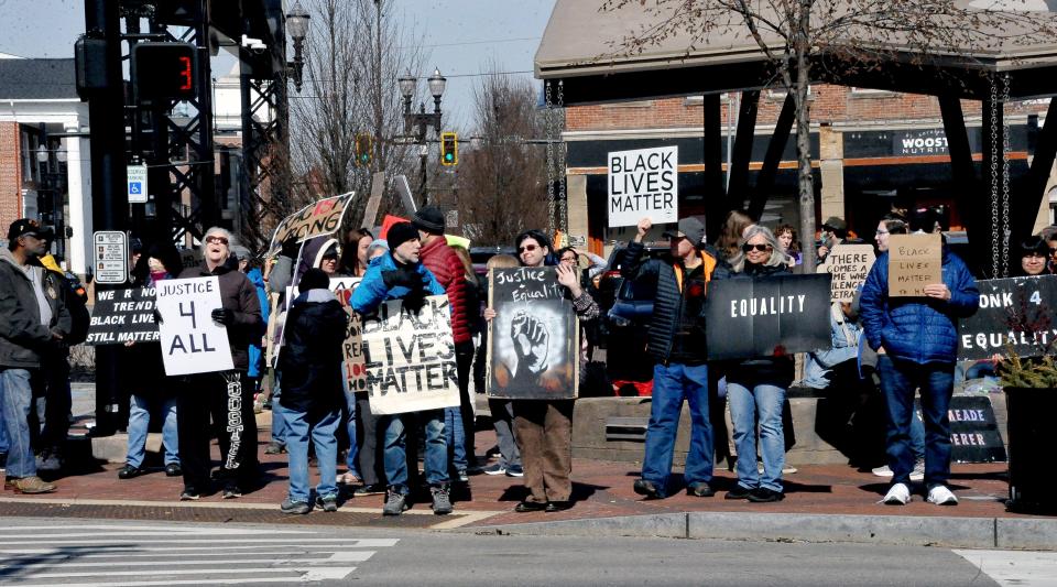 A crowd of more than 100 people line the square in Wooster Saturday, the 1,000th consecutive day of Black Lives Matter demonstrations in the city.