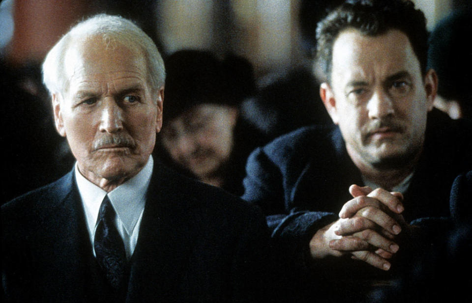 Newman and Tom Hanks sitting in a church in Road to Perdition