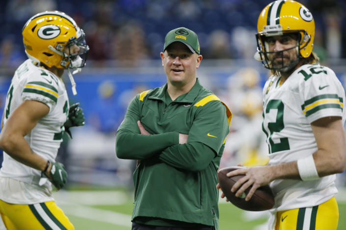 FILE - Green Bay Packers offensive coordinator Nathaniel Hackett seen during pregame of an NFL football game against the Detroit Lions, Sunday, Jan. 9, 2022, in Detroit. At right is Packers quarterback Aaron Rodgers. A person with knowledge of the negotiations told The Associated Press early Thursday morning, Jan. 27, 2022, that the Denver Broncos are finalizing a deal to hire Packers offensive coordinator as their new head coach. The person spoke on condition of anonymity because the deal was still in the works and the team hadn&#39;t announced the hiring. (AP Photo/Duane Burleson, File)