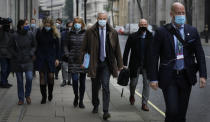 EU Chief Negotiator Michel Barnier, centre, with his team as he walks to a conference centre in Westminster in London, Sunday, Nov. 29, 2020. Teams from Britain and the European Union are continuing face-to-face talks on a post-Brexit trade deal in the little remaining time. (AP Photo/Kirsty Wigglesworth)