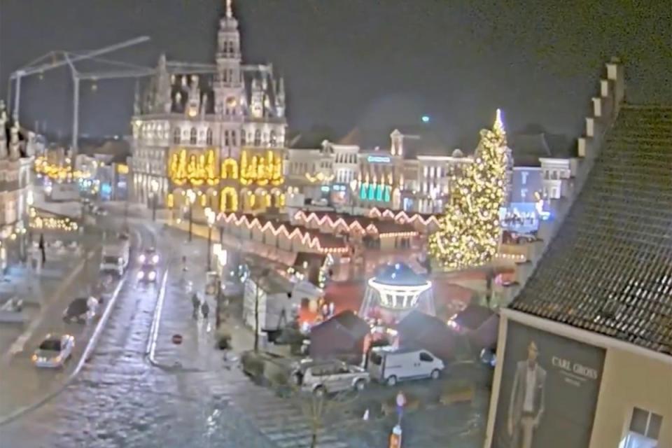 The 65ft Christmas tree collapsed next to a Christmas market in the historic town square (Koen Godderis)