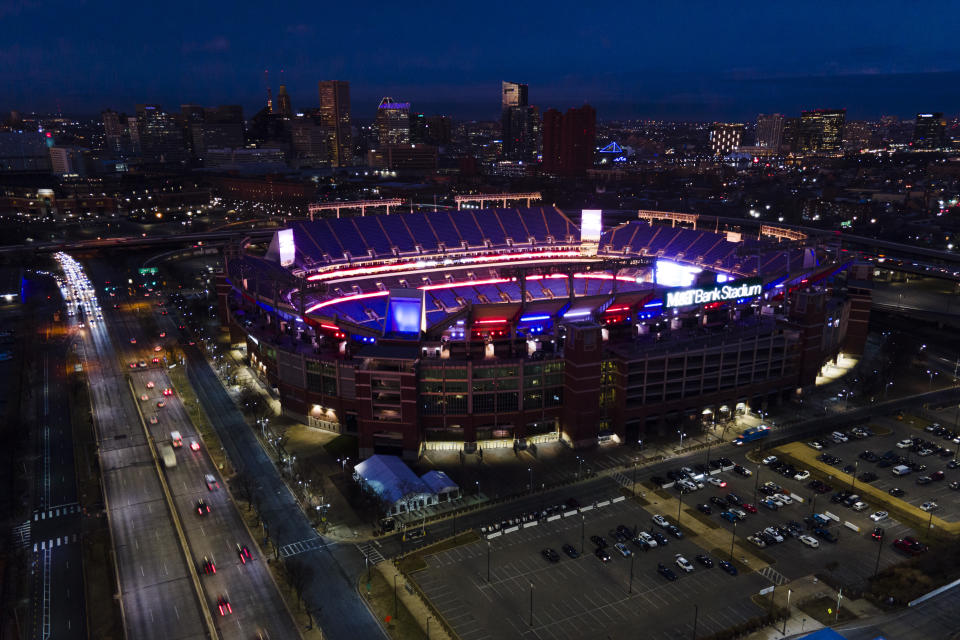 M&T Bank, the home stadium of the Baltimore Ravens, dons lights in the colors of the Buffalo Bills in support of safety Damar Hamlin, Wednesday, Jan. 4, 2023, in Baltimore. Hamlin was taken to the hospital after collapsing on the field during an NFL football game against the Cincinnati Bengals on Monday night. (AP Photo/Julio Cortez)