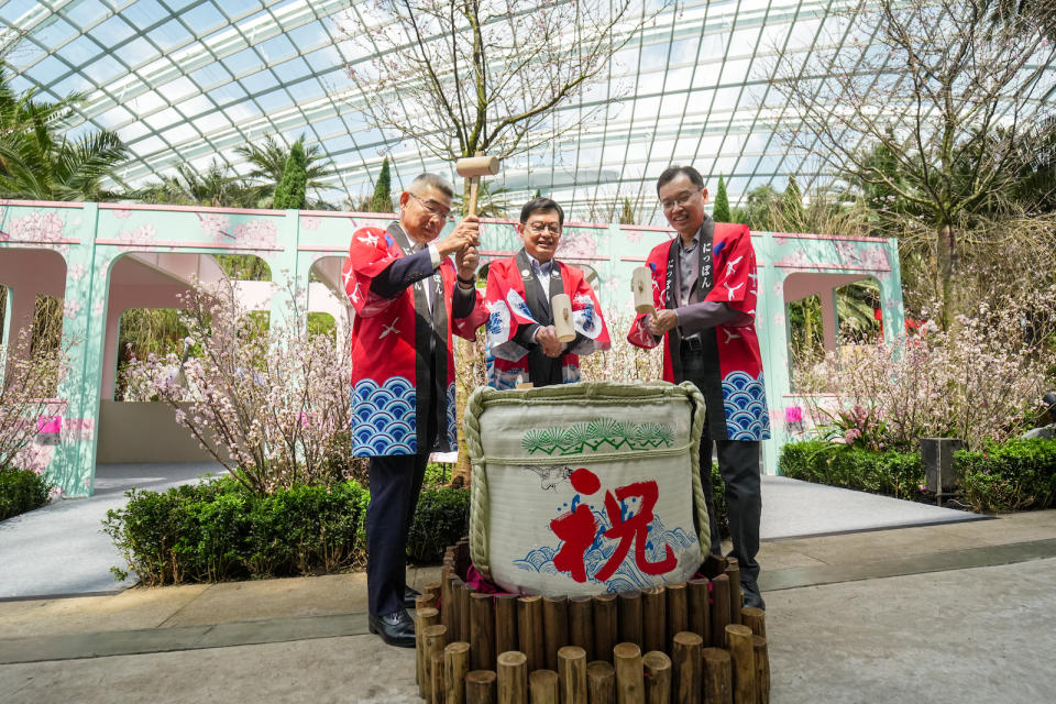 Ambassador of Japan to Singapore Hiroshi Ishikawa, Deputy Prime Minister and Coordinating Minister for Economic Policies Heng Swee Keat and Gardens by the Bay Chief Executive Officer Felix Loh breaking a traditional sake barrel to mark the launch of the Sakura floral display.