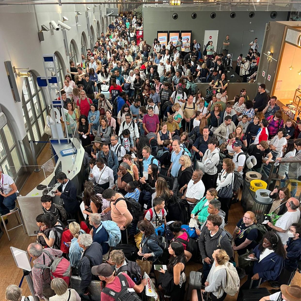 A crowded train station seen from above