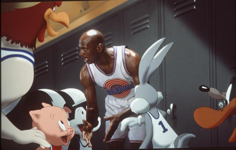 Michael Jordan surrounded by Looney Tunes characters in the movie "Space Jam"