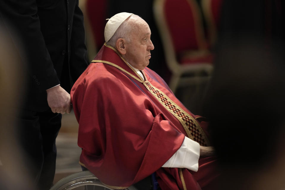 Pope Francis arrives to celebrate the Passion Mass on Good Friday, inside St. Peter's Basilica, at the Vatican, Friday, April 7, 2023. (AP Photo/Andrew Medichini)