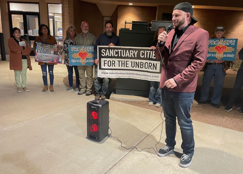 Anti-abortion activists rally ahead of a city commission meeting in Hobbs