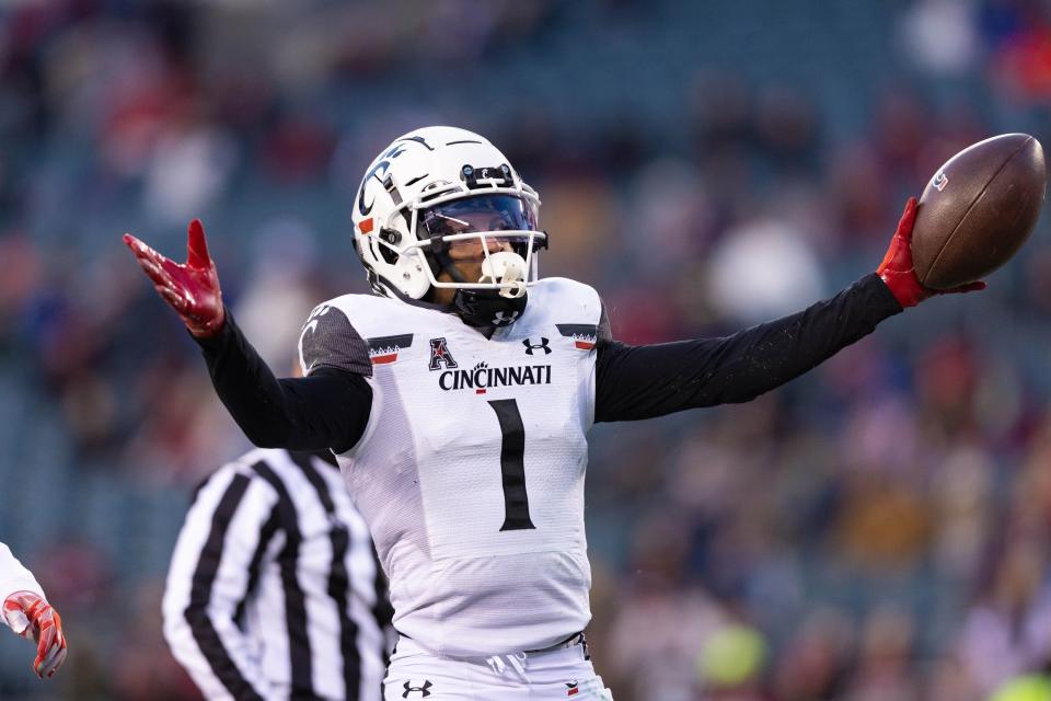 Cincinnati Bearcats wide receiver Tre Tucker celebrates a touchdown catch against the Temple Owls.