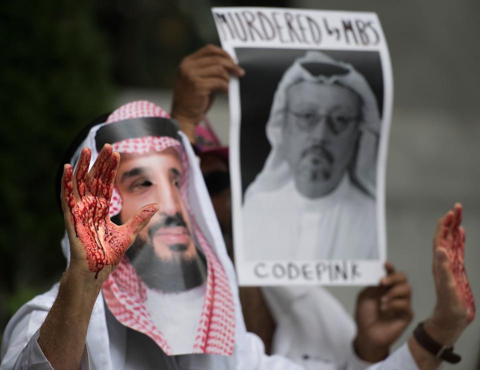 A demonstrator dressed as Saudi Crown Prince Mohammed bin Salman with blood on his hands protests outside the Saudi Embassy in Washington, D.C., on Monday, demanding justice for journalist Jamal Khashoggi.&nbsp;Trump told reporters Wednesday that he talked to Saudi leaders "more than once" since Khashoggi, a U.S. resident and Washington Post contributor, vanished on Oct. 2 after entering the Saudi consulate in Istanbul.&nbsp; (Photo: JIM WATSON/AFP via Getty Images)