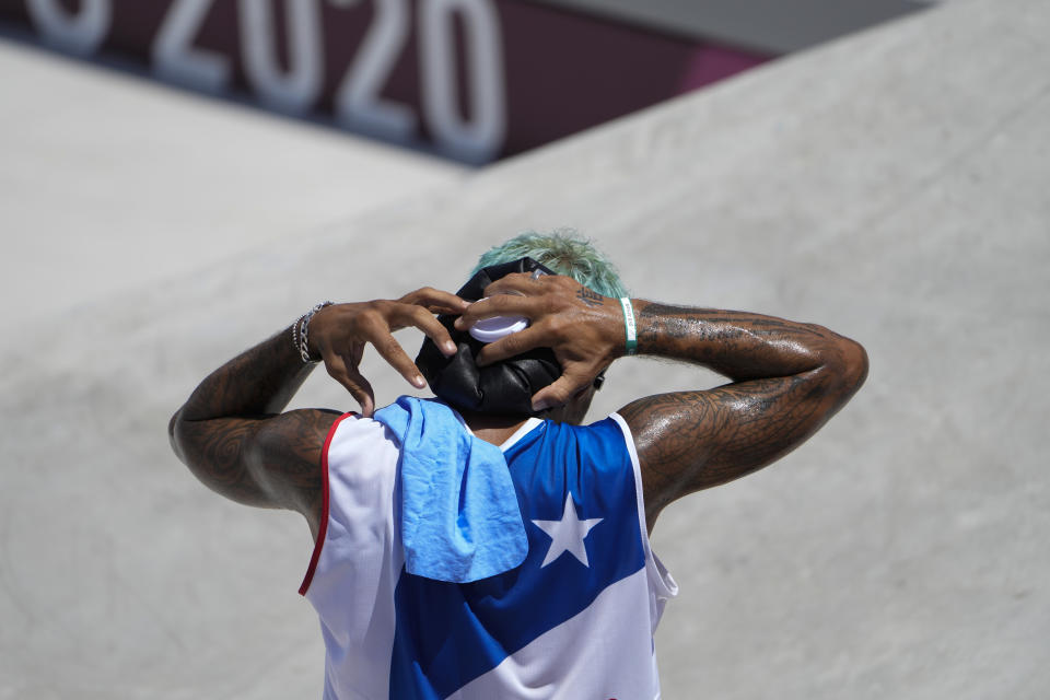 Manny Santiago of Puerto Rico cools off after competing in the men's street skateboarding at the 2020 Summer Olympics, Sunday, July 25, 2021, in Tokyo, Japan. (AP Photo/Jae C. Hong)