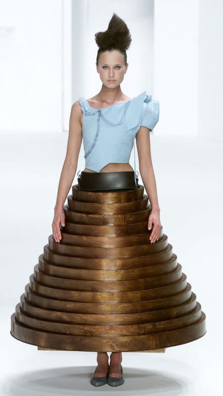 FILE PHOTO: MODEL PRESENTS A DESIGN BY HUSSEIN CHALAYAN AT LONDON FASHION WEEK.