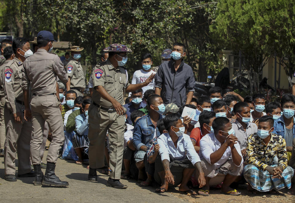 Prisoners, soon to be released marking the 74th anniversary of Myanmar's Union Day, wait for processing at the Insein prison in Yangon, Myanmar Friday, Feb. 12, 2021. Myanmar's coup leader used the country's Union Day holiday on Friday to call on people to work with the military if they want democracy, a request likely to be met with derision by protesters who are pushing for the release from detention of their country's elected leaders. (AP Photo)