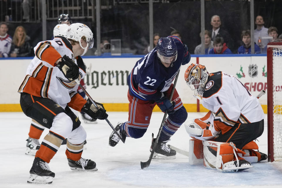 New York Rangers' Jonny Brodzinski (22) tries for a rebound after a save by Anaheim Ducks goaltender Lukas Dostal, right, during the second period of an NHL hockey game Friday, Dec. 15, 2023, in New York. (AP Photo/Seth Wenig)