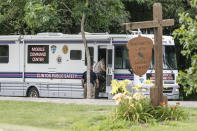Authorities enter a mobile command center at the entrance to Maquoketa Caves State Park, Friday, July 22, 2022, in Maquoketa, Iowa. Police responded to reports of the shooting at the park's campground before 6:30 a.m., Mike Krapfl, special agent in charge of the Iowa Division of Criminal Investigation, said in a statement. (Dave Kettering/Telegraph Herald via AP)