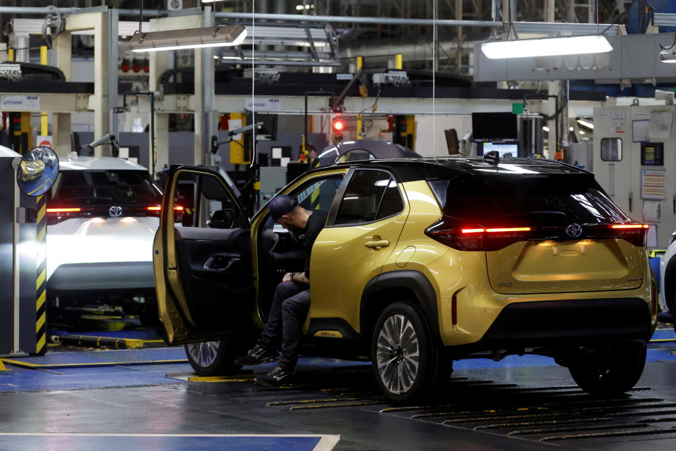 Employees work on the Yaris car assembly line at the Toyota Motor Manufacturing France (TMMF) plant in Onnaing near Valenciennes, France, March 30, 2023. REUTERS/Pascal Rossignol