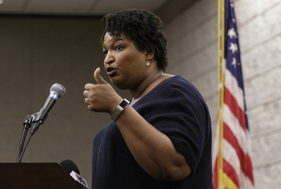 Democratic candidate for governor Stacey Abrams speaks during a town hall forum at the Dalton Convention Center on Wednesday, Aug. 1, 2018, in Dalton, Ga. Abrams is running against Republican candidate Brian Kemp in Georgia's November general election. (Doug Strickland/Chattanooga Times Free Press via AP)