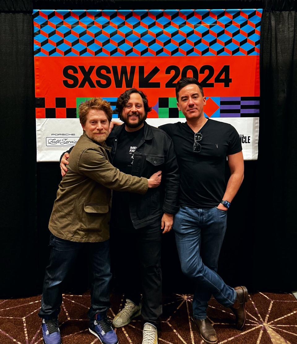 From left, actor Seth Green, Colossal Biosciences CEO Ben Lamm and filmmaker Mike Dougherty pose at South by Southwest. Green and Lamm spoke at a session about de-extinction.