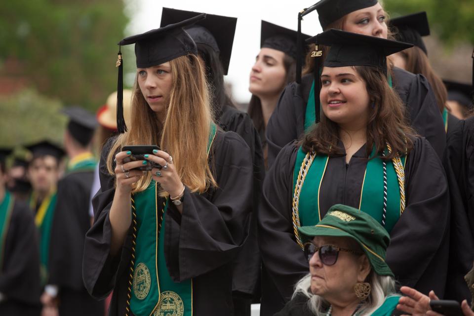 University of Vermont graduates await their commencement ceremony in this file photo.