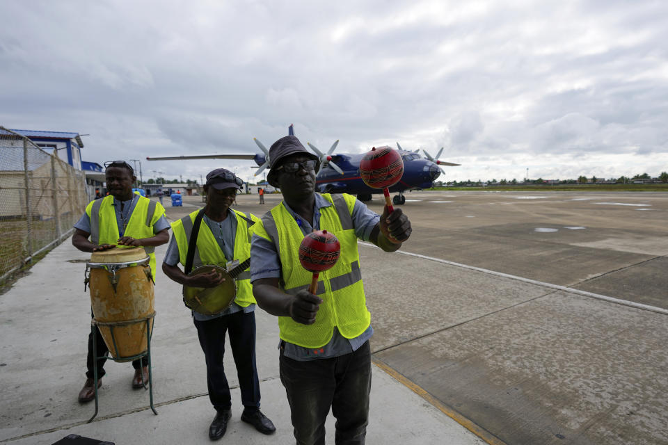 A band plays for arriving passengers at the airport in Cap-Haitien, Haiti, Wednesday, April 17, 2024. (AP Photo/Ramon Espinosa)