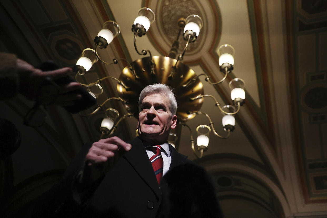 Sen. Bill Cassidy, R-La., talks with reporters as he leaves the U.S. Capitol after the first day of Trump's second impeachment trial in the Senate, Tuesday, Feb. 9, 2021, in Washington. (Chip Somodevilla/Pool via AP)