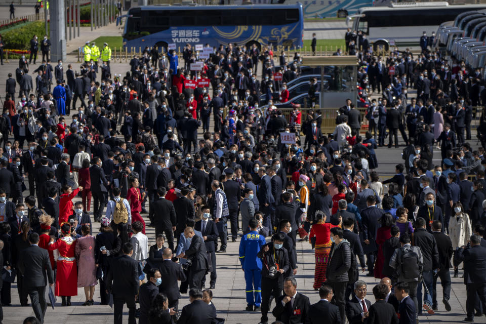 FILE - Delegates leave after the opening ceremony of the 20th National Congress of China's ruling Communist Party at the Great Hall of the People in Beijing, Sunday, Oct. 16, 2022. China’s ruling Communist Party said Monday, Oct. 17, 2022, that it has probed almost 5 million members for possible corruption over the last decade, with formal criminal cases brought against 553. (AP Photo/Mark Schiefelbein, File)