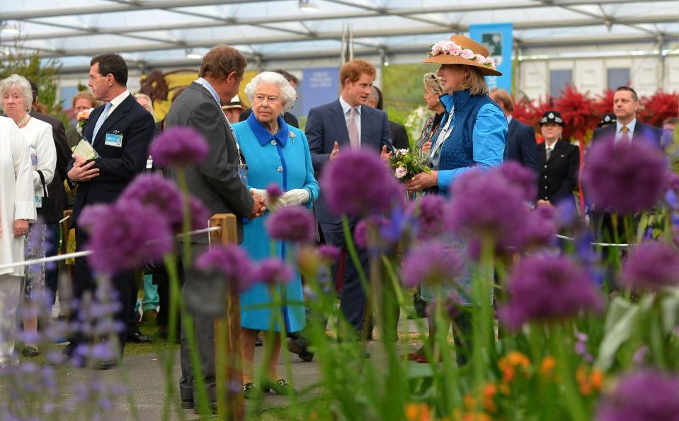 <p>The Queen and her grandson Prince Harry attend the annual Chelsea Flower Show in 2015, pictured here inside the Great Pavilion.</p>