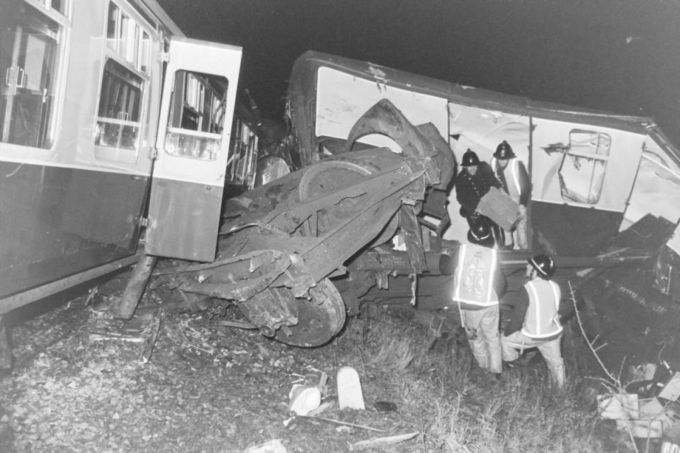 Fire crews at work amid the wreckage of the January 1975 accident i(Image: Watford Observer)/i