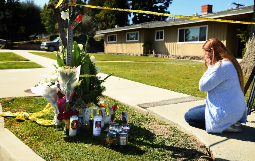 Hacienda Heights, California February 19, 2023- Kristina Provencio sheds tears as kneels near the house where Bishop David O'Connell was murdered in Hacienda Heights. (Wally Skalij/(Los Angeles Times)