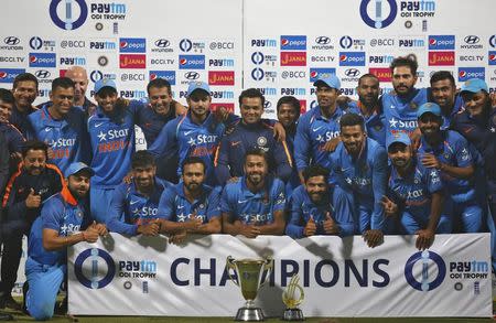 Cricket - India v England - Third One Day International - Eden Gardens, Kolkata, India - 22/01/2017. India's players pose with the trophy after winning the series. REUTERS/Rupak De Chowdhuri
