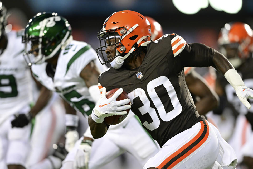 Cleveland Browns running back Hassan Hall (30) carries the ball against the New York Jets during the first half of the Hall of Fame NFL football preseason game Thursday, Aug. 3, 2023, in Canton, Ohio. (AP Photo/David Dermer)