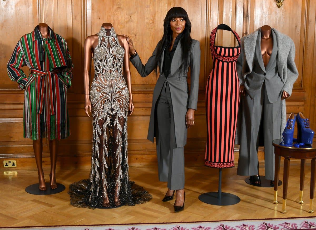 Campbell pictured alongside clothes that have typified key moments in her career (Getty Images)