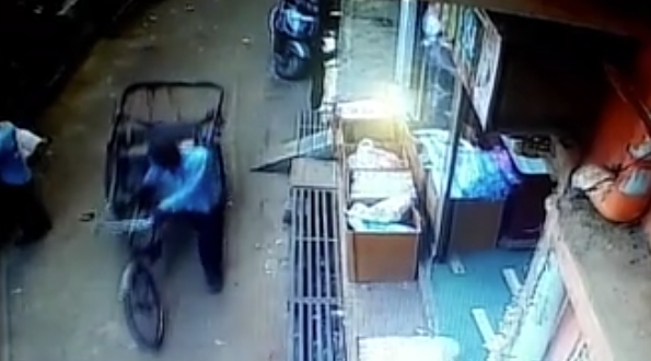 The rickshaw driver is seen in CCTV footage going through a bus street. (Caters)