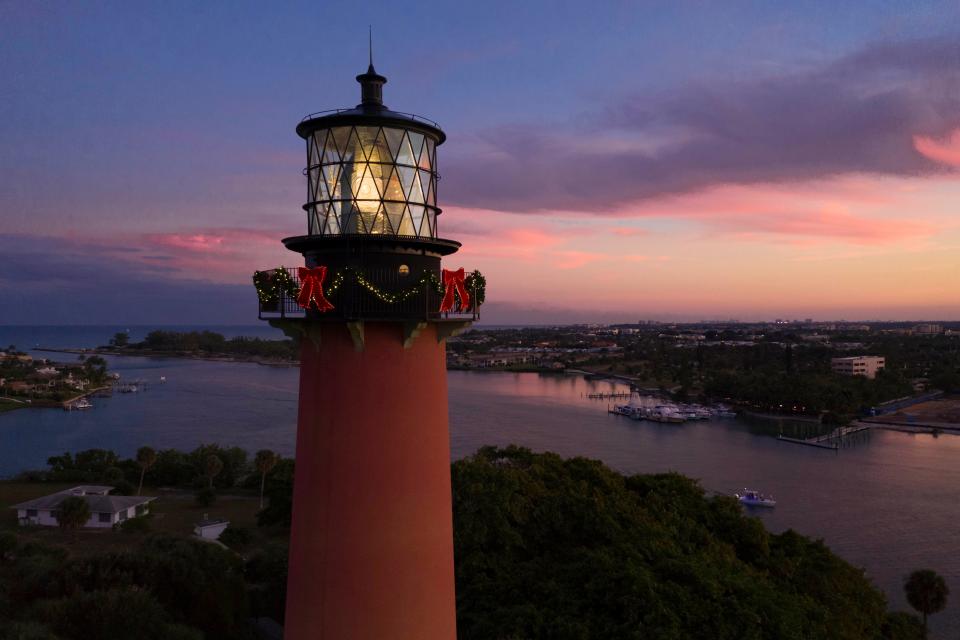 The sun sets at the Jupiter Inlet Lighthouse in Jupiter, Florida on December 17, 2018. [GREG LOVETT / palmbeachpost.com]