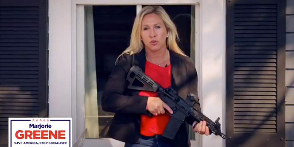 Republican congressional candidate Marjorie Taylor Greene brandishes an AR-15 while defending property against nonexistent "antifa" activists in a promotional video. (Photo: Marjorie Taylor Greene/YouTube)