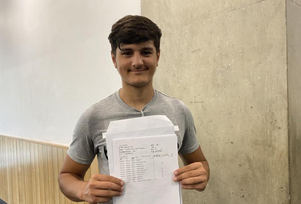 Adam Qureshi receiving his GCSE results at Westminster Academy (Claudia Rowan/PA) (PA Wire)