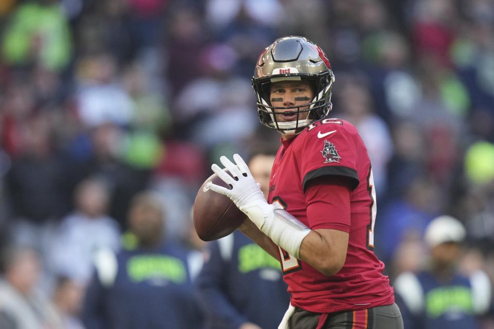 Tampa Bay Buccaneers quarterback Tom Brady throws before an NFL football game against the Seattle Seahawks, Sunday, Nov. 13, 2022, in Munich, Germany. (AP Photo/Matthias Schrader)