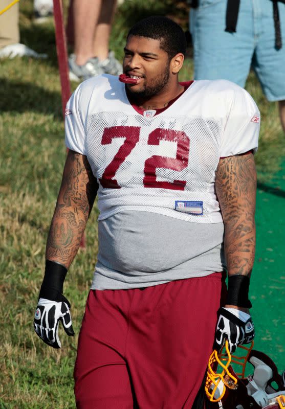 Washington Redskins first round draft pick Trent Williams heads to the field during the second day of the team's NFL football training camp in Ashburn,