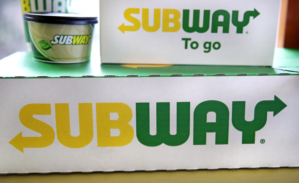File - The Subway logo is seen on takeout boxes at a restaurant in Londonderry, N.H., on Feb. 23, 2018. The sandwich chain said Thursday it will be sold to the private equity firm Roark Capital. Terms of the deal weren't disclosed. (AP Photo/Charles Krupa, File)