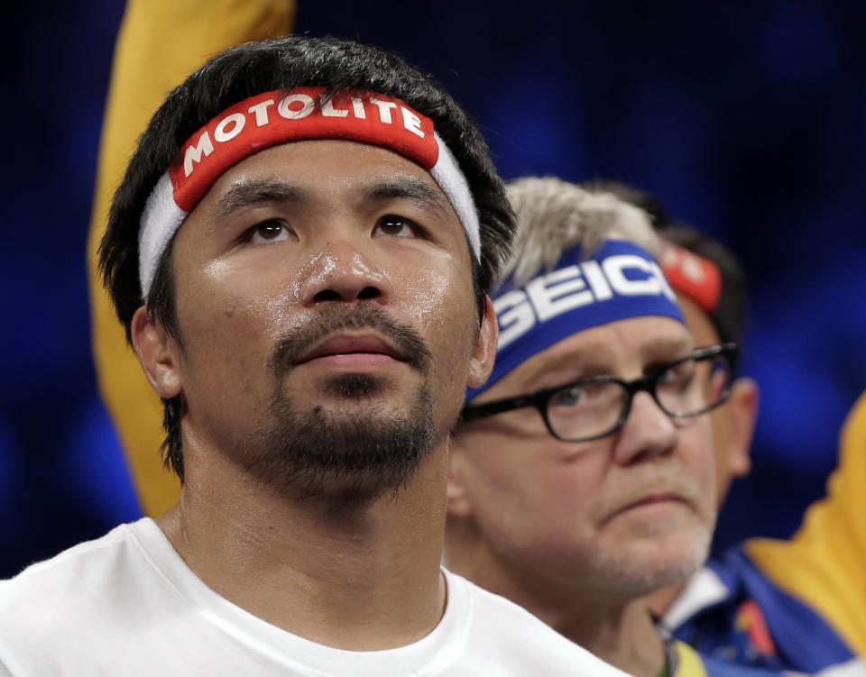 Manny Pacquiao, from the Philippines, gets ready before the welterweight title fight against  Floyd Mayweather Jr., on Saturday, May 2, 2015 in Las Vegas.  (AP Photo/Isaac Brekken)