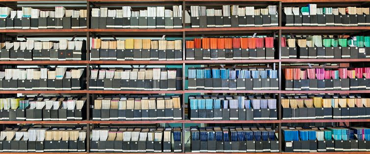 Library shelves full of academic journals.