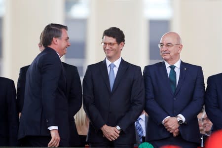 Brazil's President Jair Bolsonaro, Brazil's Environment Minister Ricardo Salles and Citizenship Minister Osmar Terra attend a Soldier's Day ceremony, in Brasilia