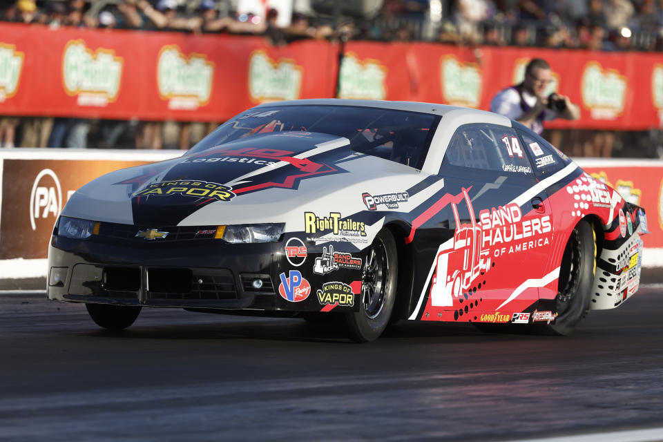 In this photo provided by the NHRA, Camrie Caruso drives in Pro Stock qualifying Friday, April 22, 2022, during the NHRA SpringNationals drag races at Houston Raceway Park in Baytown, Texas. (Randy Anderson/NHRA via AP)