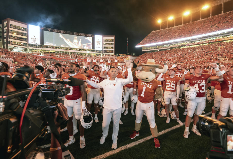 Texas coach Steve Sarkisian and his team sing "The Eyes of Texas" after a win in an NCAA college football game against Wyoming, Saturday, Sept. 16, 2023, in Austin, Texas. (AP Photo/Michael Thomas)