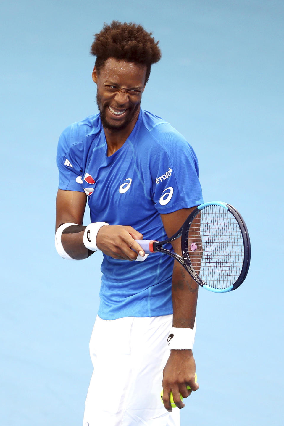 Gael Monfils of France reacts after scoring a point during his match against Cristian Garin of Chile at the ATP Cup tennis tournament in Brisbane, Australia, Saturday, Jan. 4, 2020. (AP Photo/Tertius Pickard)